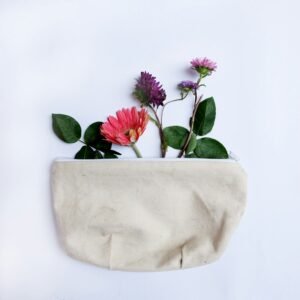 Neutral canvas accessories pouch with floral styling